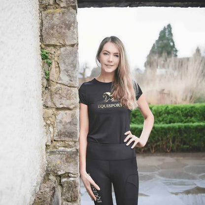 Equisport Equestrian Sports T-Shirt model wearing black athletic gear outdoors